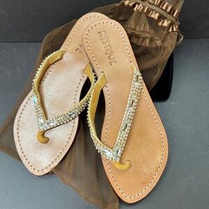 Fancy rhinestone and leather flip flops